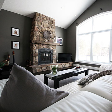 Living Room with Rustic Fireplace and Large Window