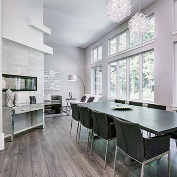 Dining room with fireplace and wall of windows