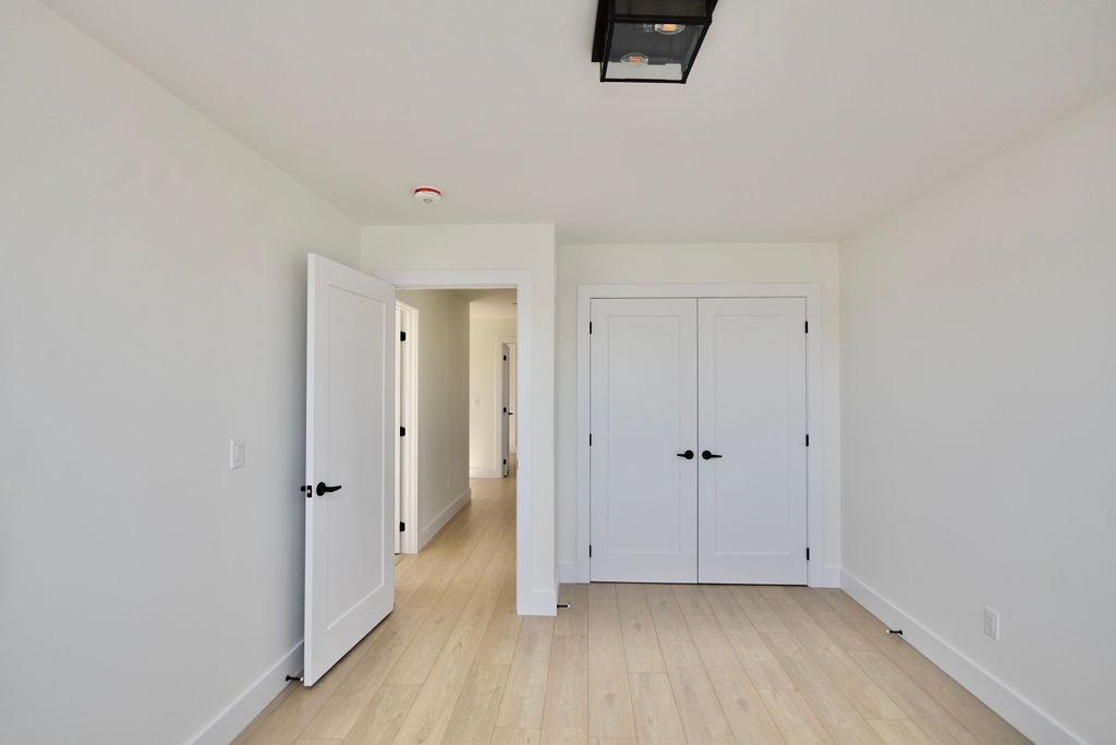 Upstairs 3rd bedroom with double door closet.